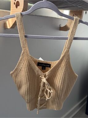 Cream knit crop top with lace up detail